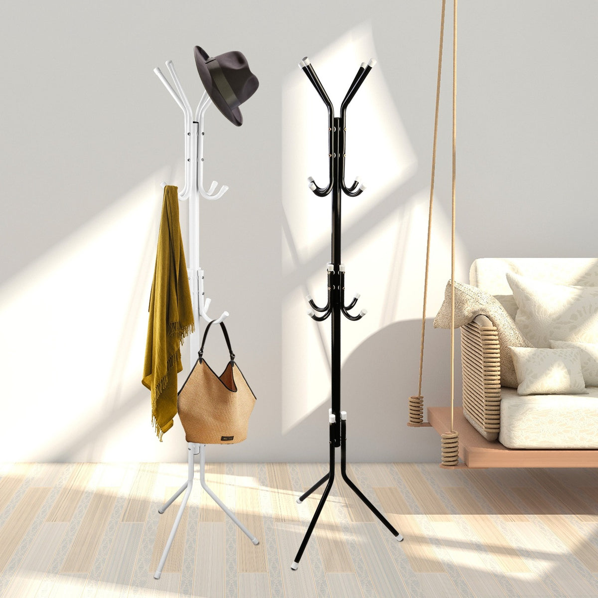 White and black standing coat racks with bag, scarf and hat