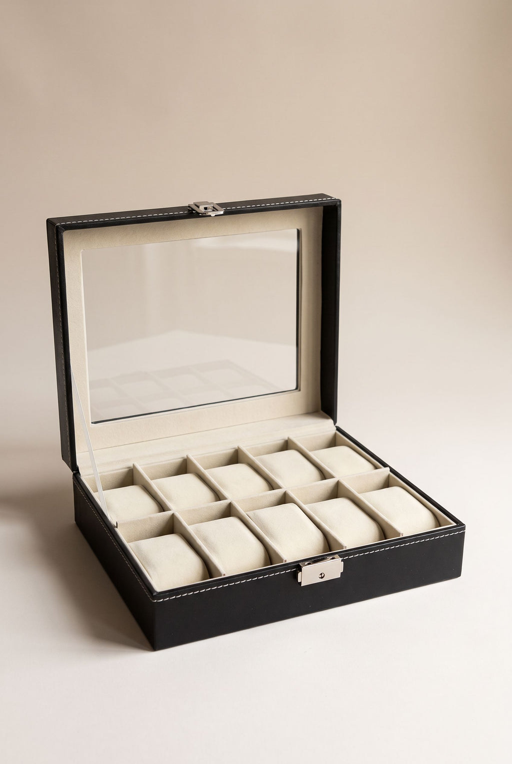 Black 10-slot watch box with clear window lid open, cream cushions, empty
