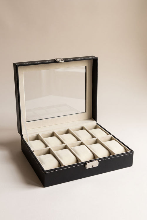 Black 10-slot watch box with clear window lid open, cream cushions, empty