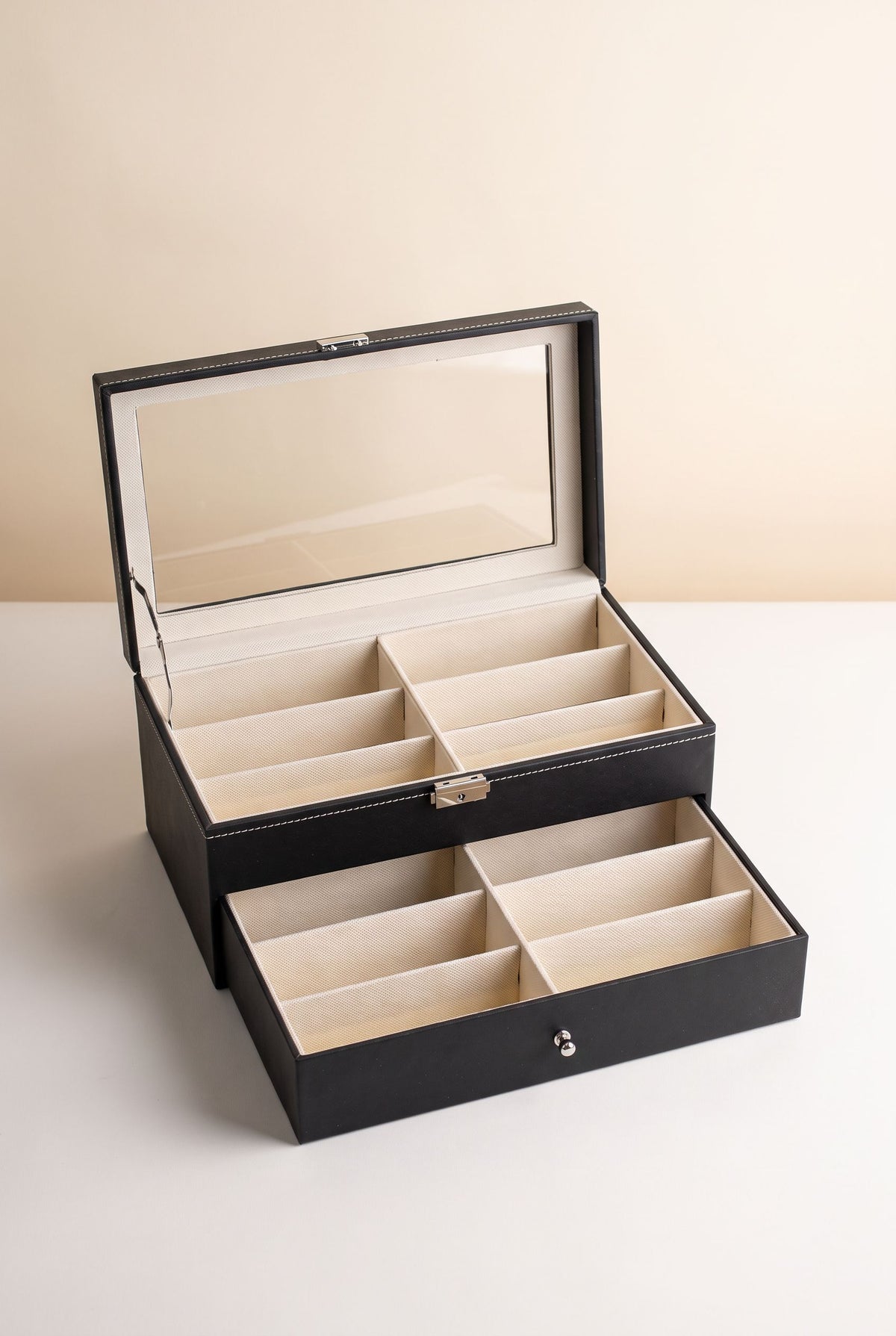 Black two-tier 12-slot eyewear organizer with glass lid open and drawer pulled out, empty