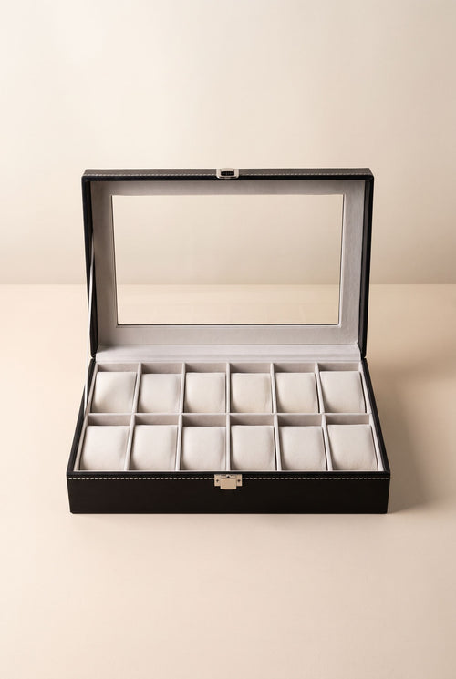 Black 12-slot watch display case with window lid open, 12 cushions in two rows, empty