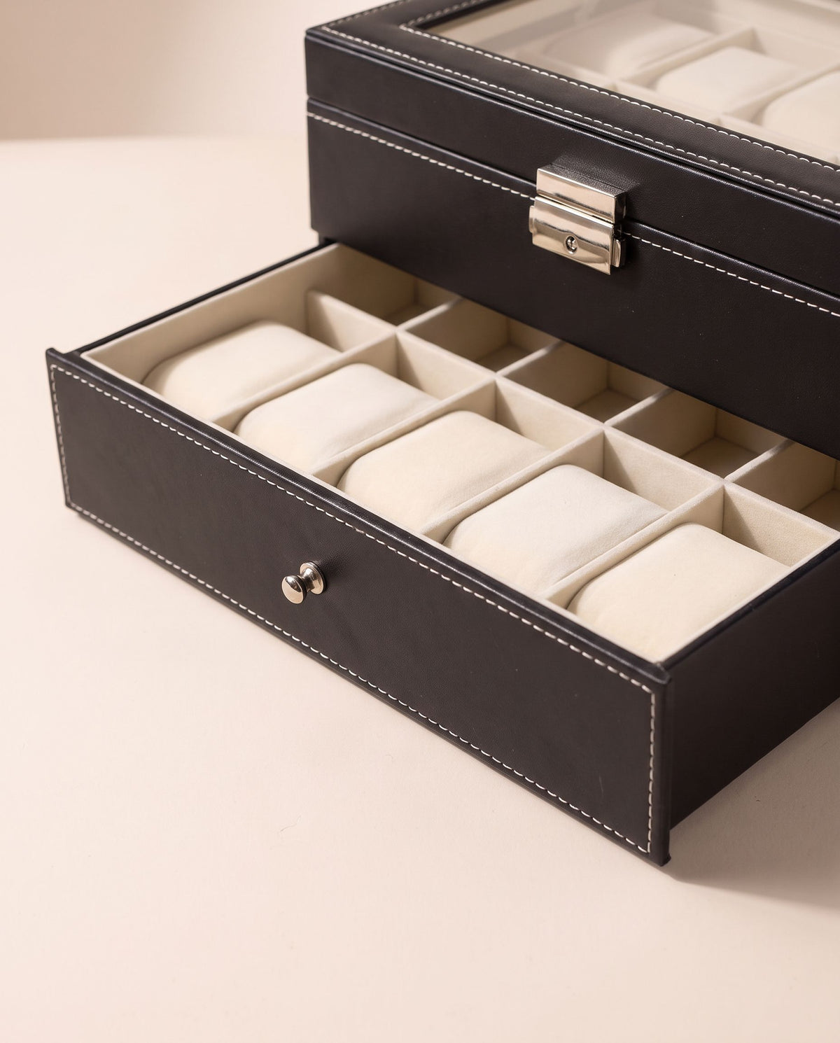 Lower pull-out drawer of the two-tier watch box with 10 cream cushions
