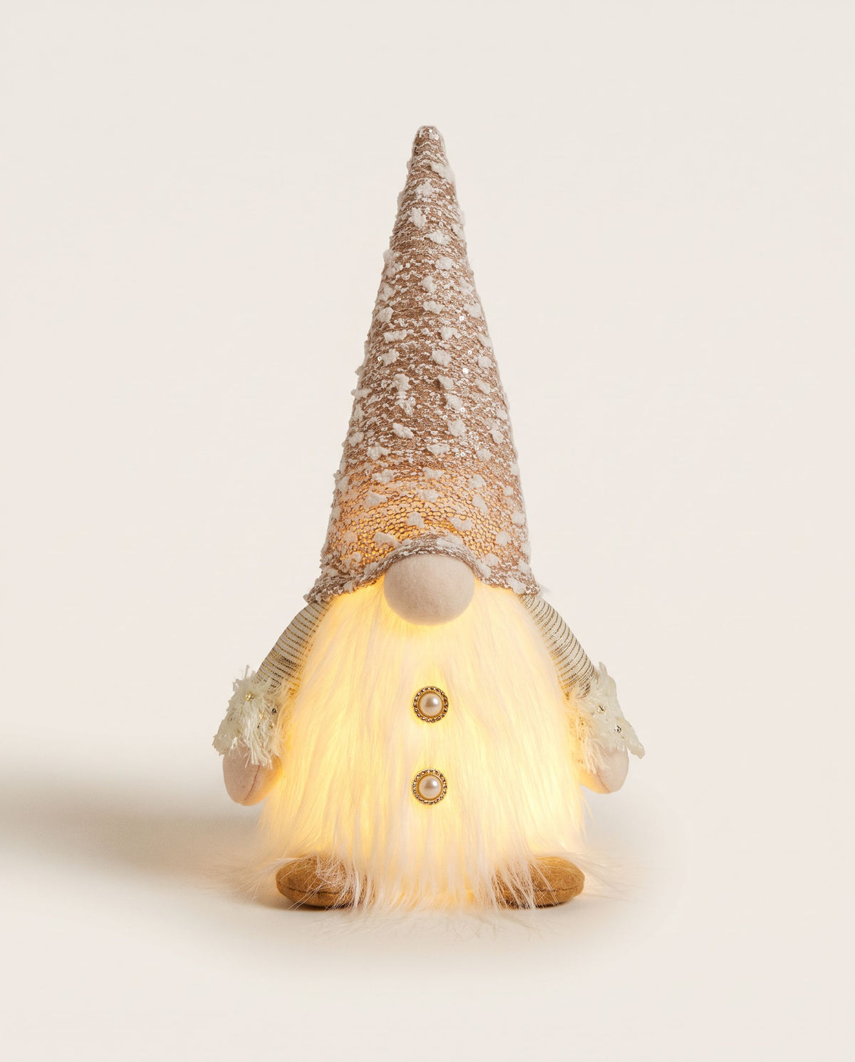 Christmas gnome with tall champagne sparkle hat and glowing white fluffy beard with gold buttons