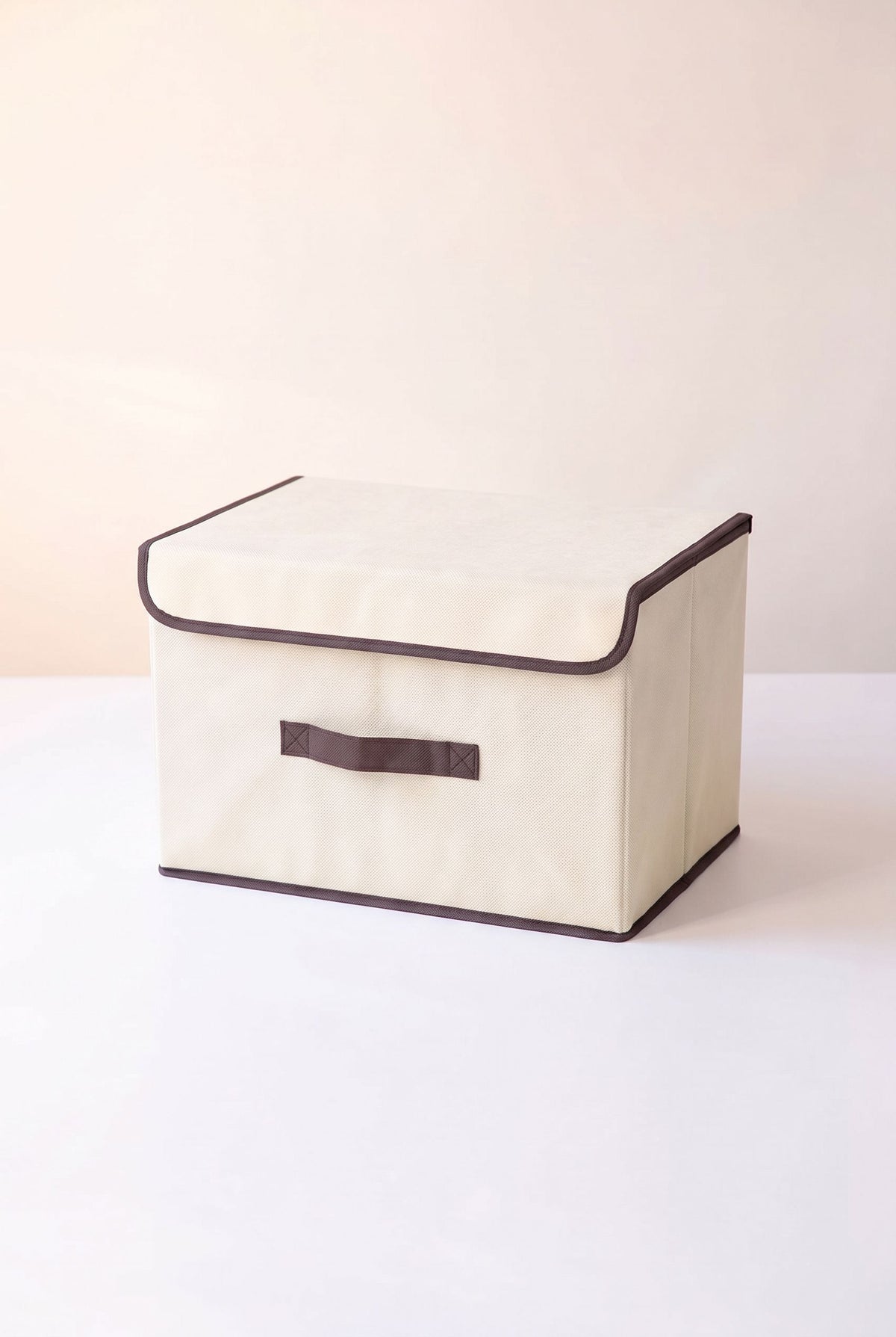 Off-white foldable fabric storage box with flip cover and front handle
