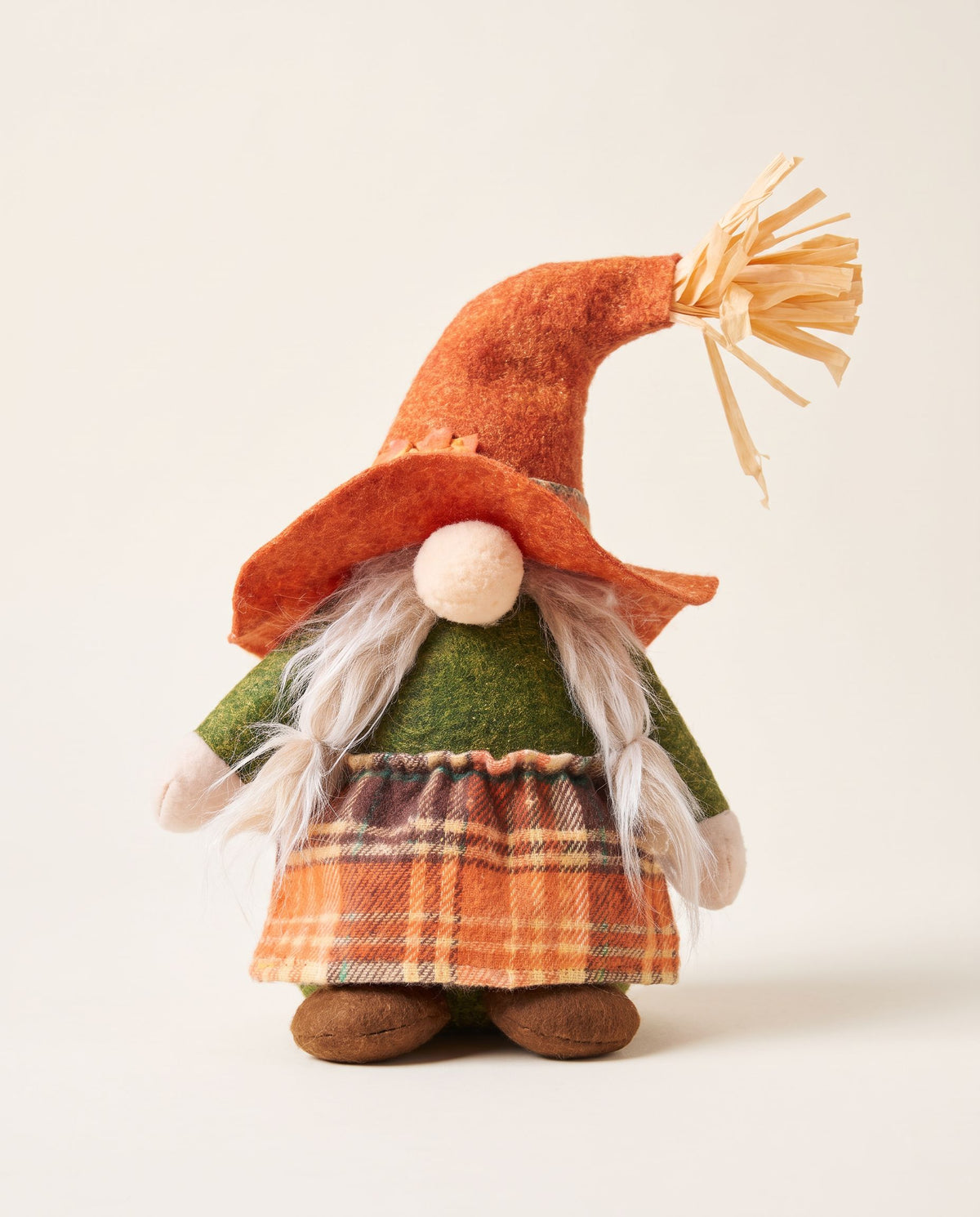 Scarecrow gnome plush with orange straw-tuft hat, blonde braids, green top and orange plaid skirt