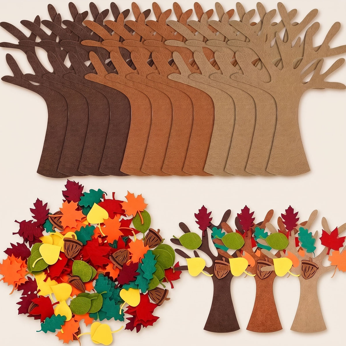 Felt gratitude tree kit: 12 felt trees in three brown shades, a pile of felt autumn leaves and acorns, and three decorated trees