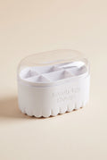 Beauty sponge storage box with white fluted base and clear domed lid, empty
