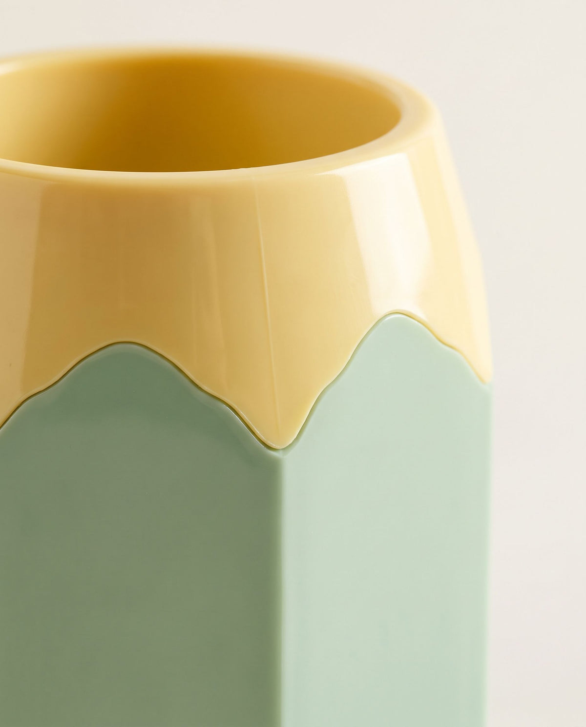 Close detail of the scalloped collar and the hexagonal faceted barrel