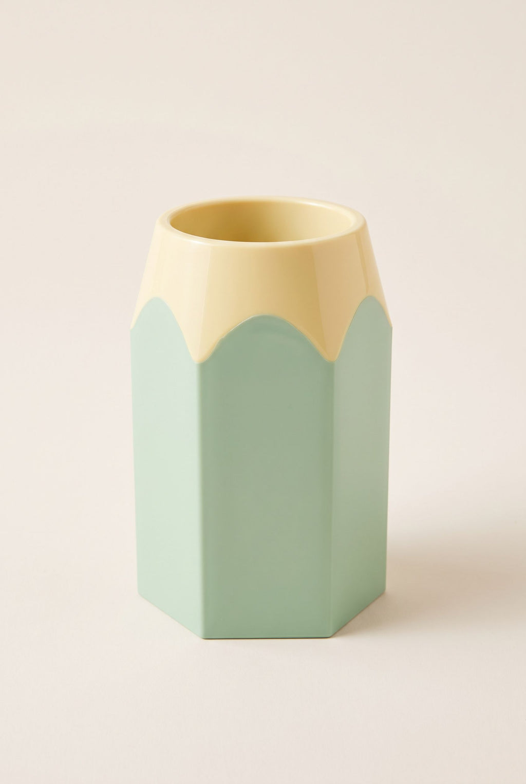 Pencil-shaped desk pen holder in Nordic Green with a pale yellow collar, empty