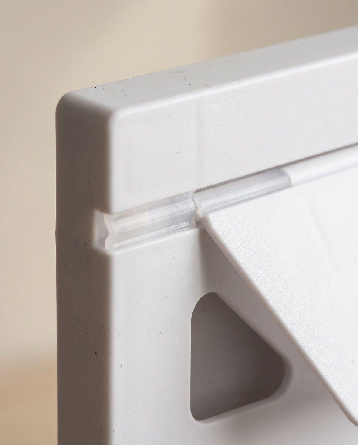 Close detail of a hinge and the thickened board edge