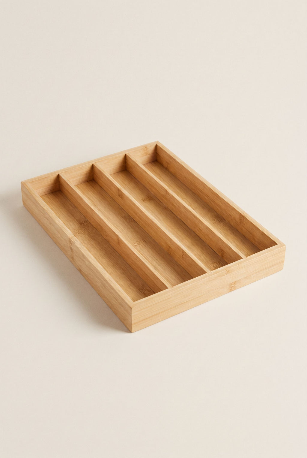 Solid bamboo cutlery tray with five long parallel compartments, empty